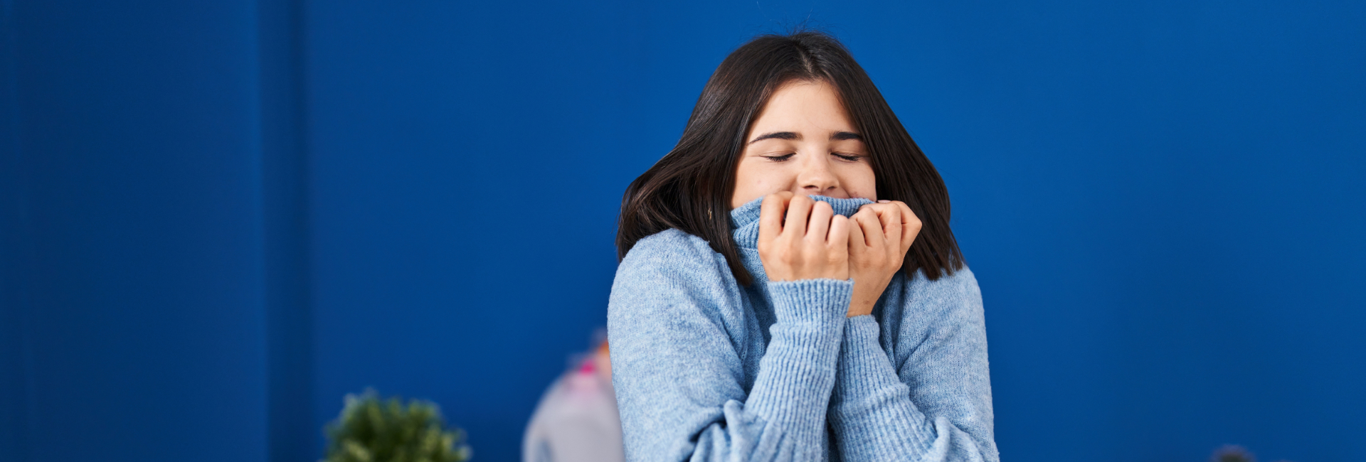 Girl Smelling Her Fresh Clean Sweater 1920X650