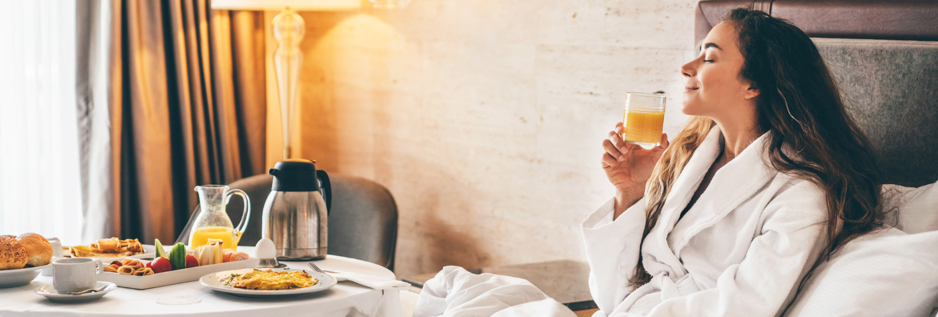 Woman Enjoying Breakfast In Bed At Hotel 1920X650